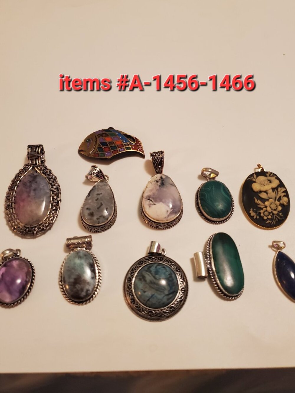 11 Pendants, items # A-1456-1466, wt.  147 grams.